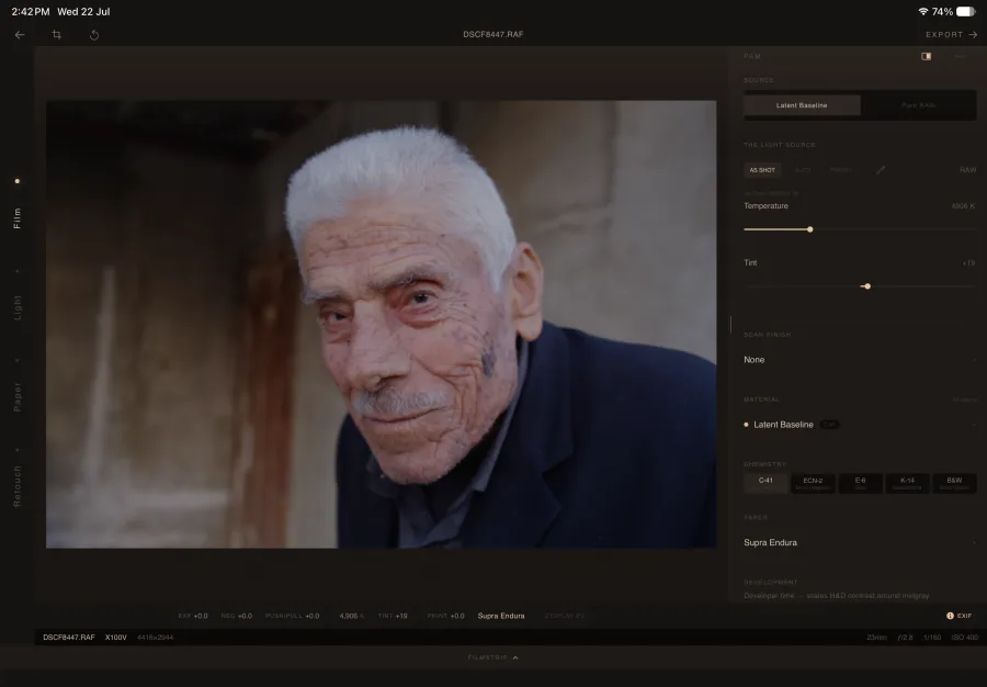 The same portrait open in the Darkroom on iPad — the same emulsion, chemistry, paper and Retouch, under your hands